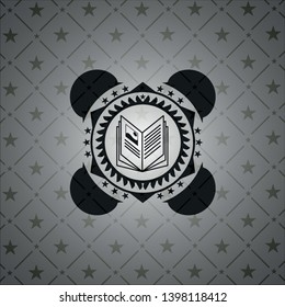 book icon inside dark badge or emblem