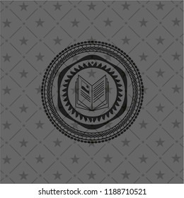 book icon inside dark emblem. Retro