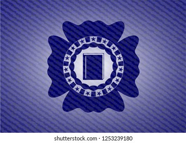 book icon inside emblem with denim texture
