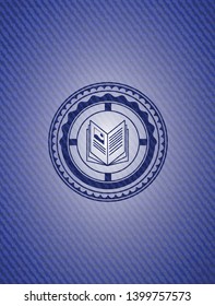 book icon inside emblem with denim texture