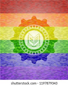 book icon inside emblem on mosaic background with the colors of the LGBT flag