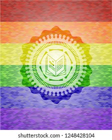 book icon inside emblem on mosaic background with the colors of the LGBT flag