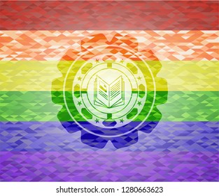 book icon inside emblem on mosaic background with the colors of the LGBT flag