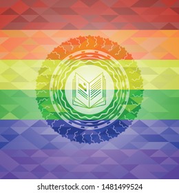 book icon inside emblem on mosaic background with the colors of the LGBT flag