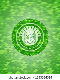 book icon inside green emblem with mosaic ecological style background. 