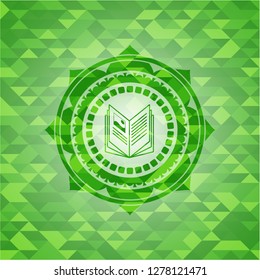 book icon inside green mosaic emblem