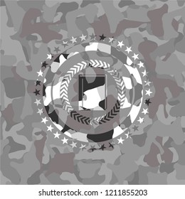 book icon inside grey camouflaged emblem