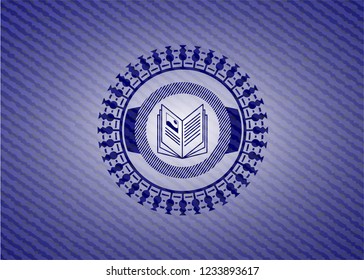 book icon inside jean or denim emblem or badge background
