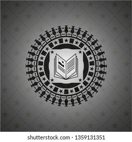 book icon inside realistic dark emblem
