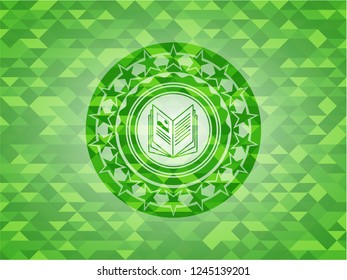 book icon inside realistic green mosaic emblem