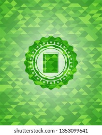 book icon inside realistic green emblem. Mosaic background