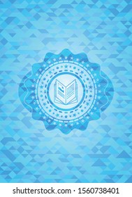 book icon inside realistic light blue mosaic emblem