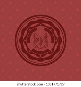 book icon inside retro style red emblem