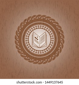 book icon inside retro style wood emblem