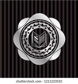 book icon inside silver badge or emblem