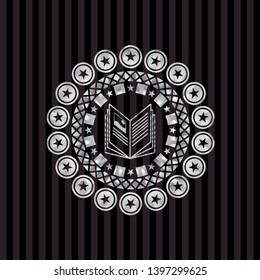 book icon inside silver badge or emblem