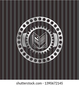 book icon inside silvery emblem