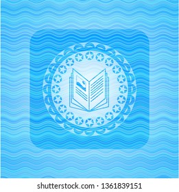 book icon inside sky blue water wave style badge.