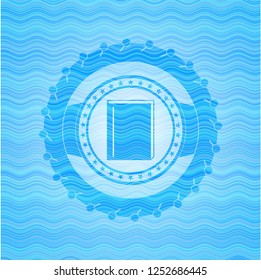 book icon inside water concept style emblem.