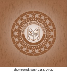 book icon inside wood emblem