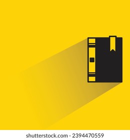 book icon with shadow on yellow background