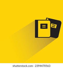 icono de libro con sombra sobre fondo amarillo