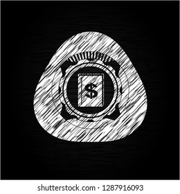 book with money symbol inside icon drawn on a chalkboard