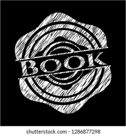 Book on chalkboard
