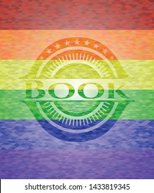Book on mosaic background with the colors of the LGBT flag