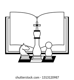 Book open with chess pieces in black and white