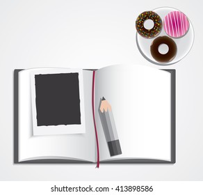 book, pencil,  donut and instant photo 