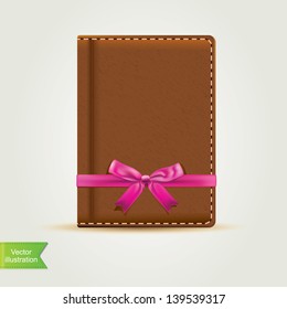 Book with pink bow.Vector illustration.