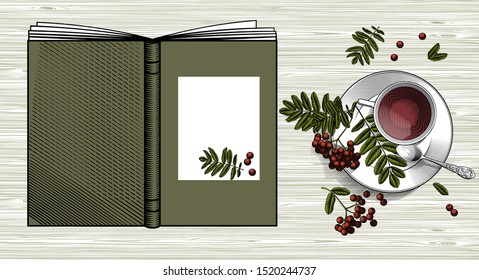 A book, a rowan and a cup of tea on an old wooden table. Vintage engraving stylized drawing. Vector illustration