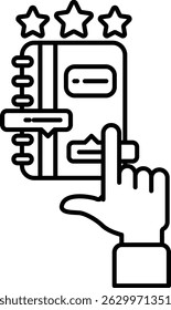 A book with a star on it and a finger pointing to it. The book is a journal or diary