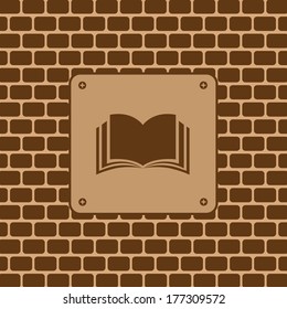 book symbols on brick wall 