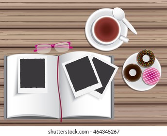 book, tea cup donut and instant photo view on top
