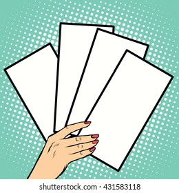 Booklets or tickets in hand