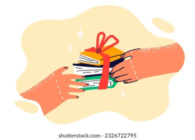 Books with gift ribbon in hands of person symbolize prize to student of school for winning olympiad. Gift of books to advertise bookstore or library with collection of literature and encyclopedias.