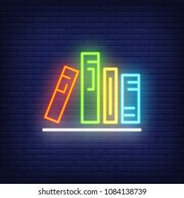 Books on shelf neon sign. Various colorful in row on shelf. Night bright advertisement. Vector illustration in neon style for literature and library