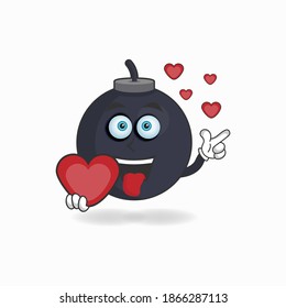 Boom mascot character holding a love icon. vector illustration