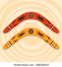 Boomerangs isolated on beige background with circles. Tribal style. Australian style. Vector illustration.