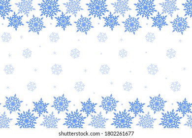 Border of blue openwork snowflakes on a white background with small pale blue snowflakes. Seamless horizontal background for festive design, Christmas or New Year greeting card, banner and wallpaper
