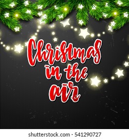 border Card design and Glowing star Lights. poster with a handwritten inscription. Brush Calligraphy "christmas in the air"