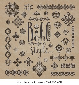 Border and decoration ethnic signs set with Boho style hand drawn lettering. Handmade calligraphy in black  on cardboard texture craft paper background.  For your ethnic design. Vector illustration.