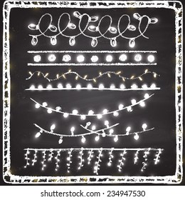 Border. Set of shining Christmas lights chalk.