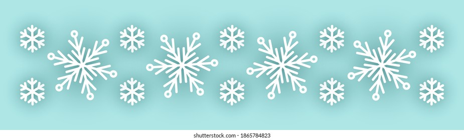 Border with white paper snowflakes on light blue - a decorative element for natural, New Year and Christmas winter design