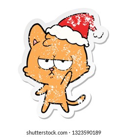 bored hand drawn distressed sticker cartoon of a cat wearing santa hat