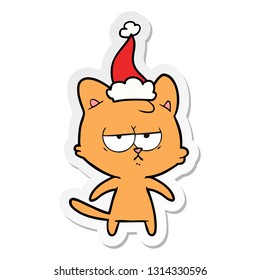 bored hand drawn sticker cartoon of a cat wearing santa hat