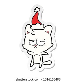 bored hand drawn sticker cartoon of a cat wearing santa hat
