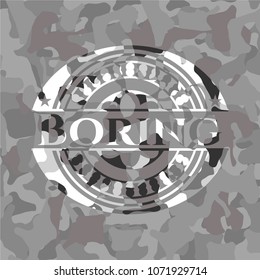  Boring written on a grey camouflage texture